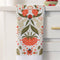 folded ladybug and red floral abstract tea towel on a counter