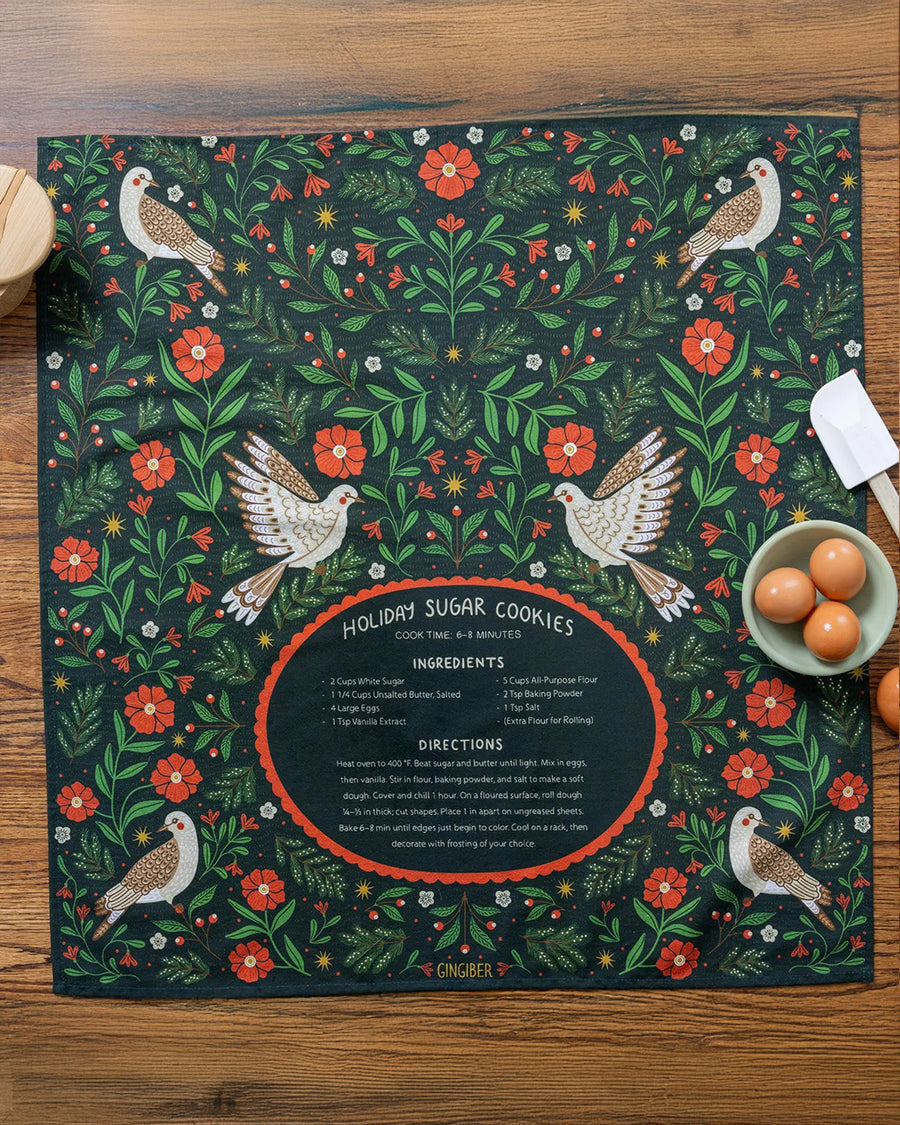 green tea towel with holiday sugar cookies with red floral and partridge print