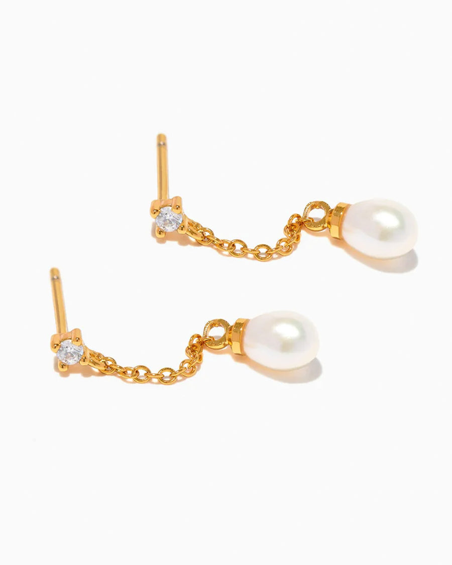 gold dangle earrings with crystal stud and pearl drop on its side
