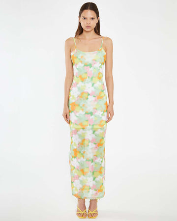 model wearing white and colorful blurred floral tank maxi dress