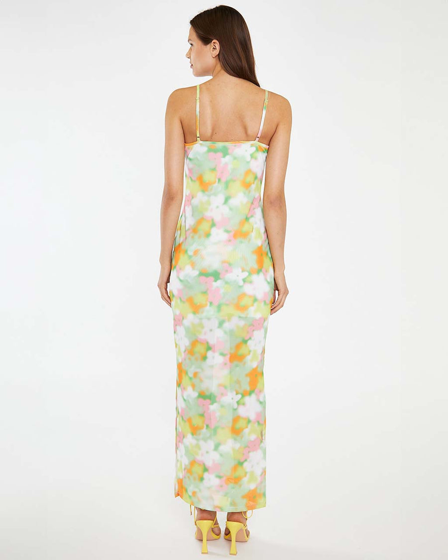back view of model wearing white and colorful blurred floral tank maxi dress