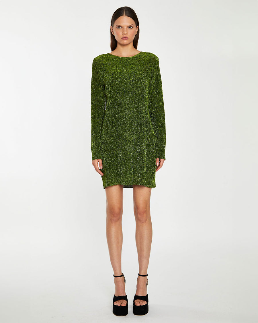 model wearing black and green glitter mini dress with long sleeves