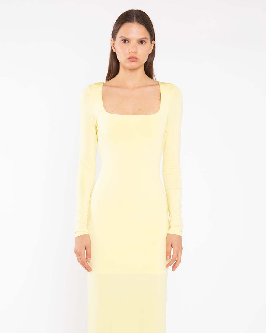 up close of model wearing yellow square neck long sleeve knit maxi dress