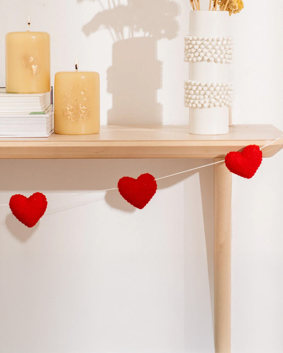 red heart felt garland on a table