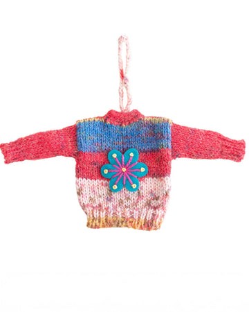 multicolor sweater ornament with a blue flower on the front