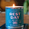 blue rest day candle on a coffee table