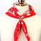 brass floral scarf slide + ring on a red scarf