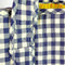 up close of blue and white gingham tote bag with yellow printed interior