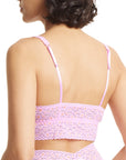backview of model wearing pink and orange leopard bralette