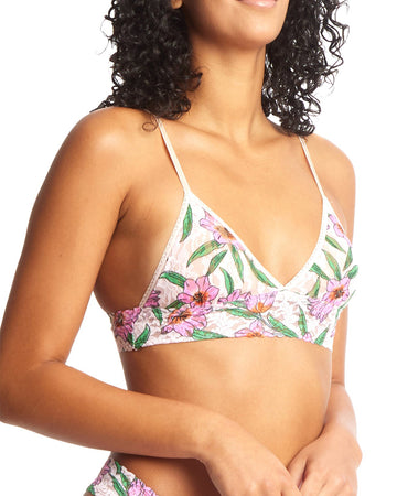 model wearing white lace bralette with pink flower print