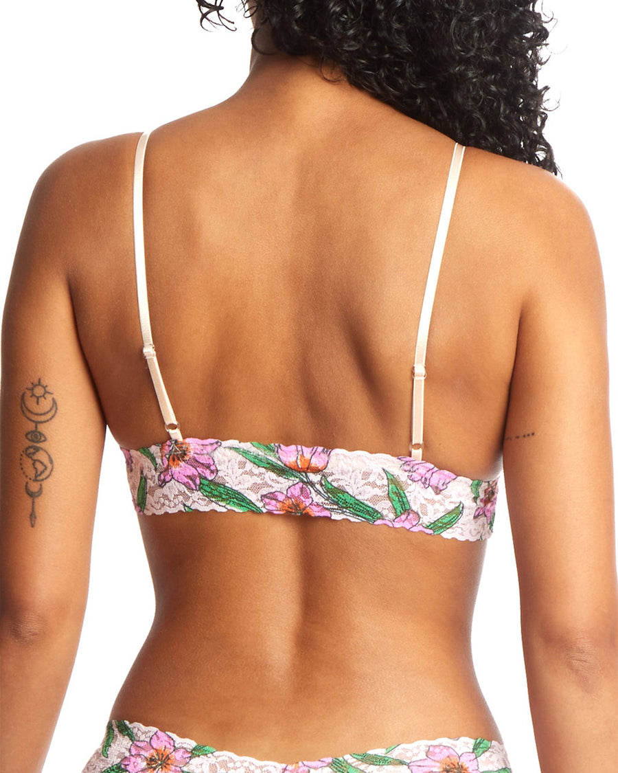 backview of model wearing white lace bralette with pink flower print