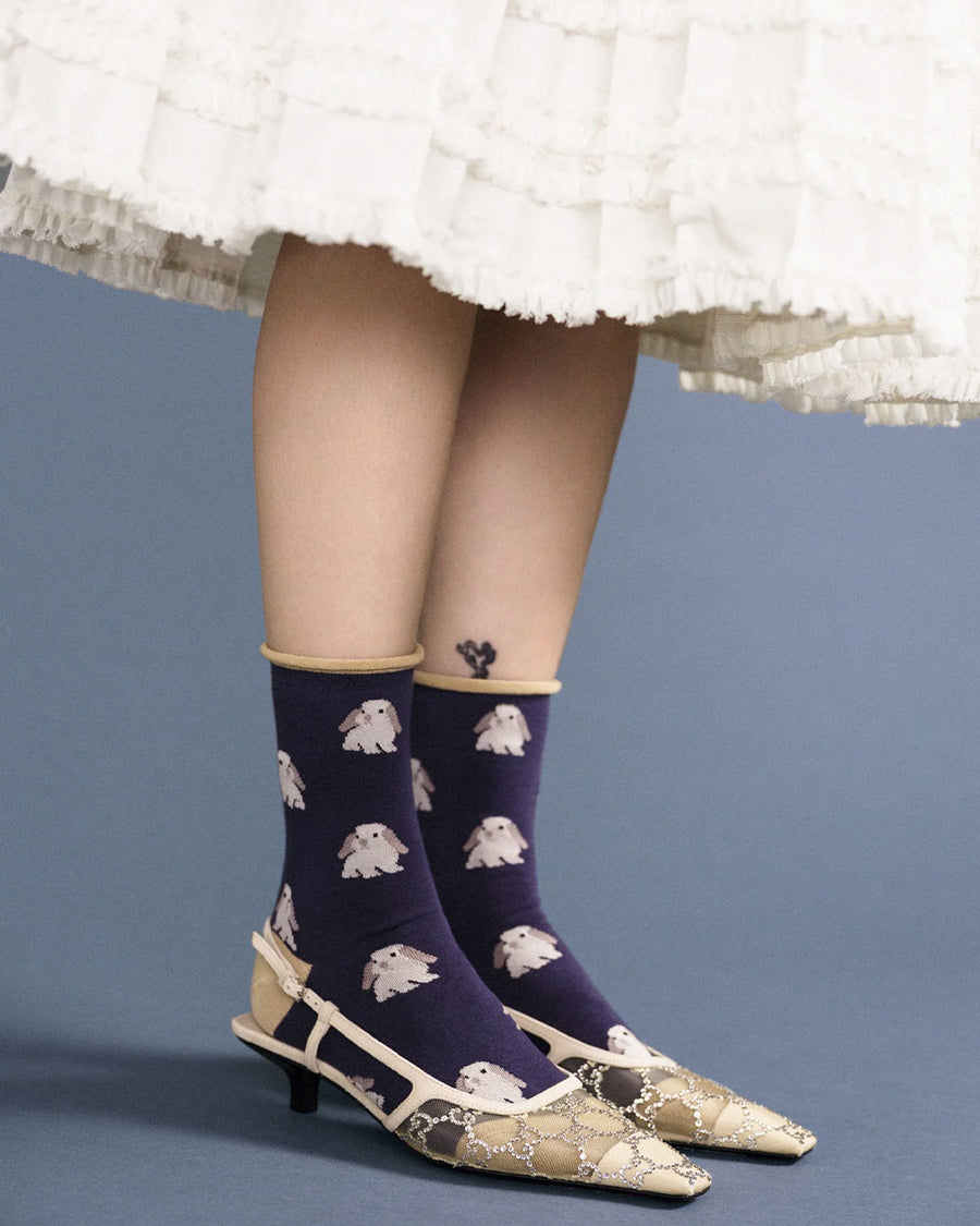 model wearing navy crew socks with bunny print