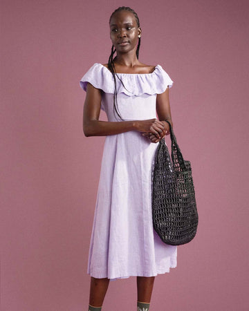 model holding black paper crochet bag