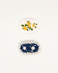 set of two crochet hair clips: yellow flower and navy flower