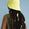 back view of model wearing lemon tulip bucket hat with straps