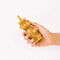 model holding honey bear shaped beeswax candle