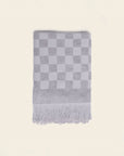 folded grey checkered bath towel