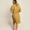 backview of model wearing burnt mustard robe with embossed smiley design
