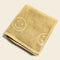 folded mustard smiley embossed towel