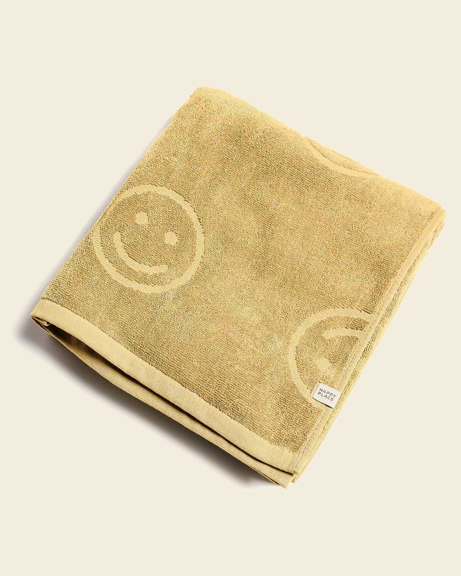 folded mustard smiley embossed towel