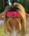 top view of hot pink pleather knotted headband