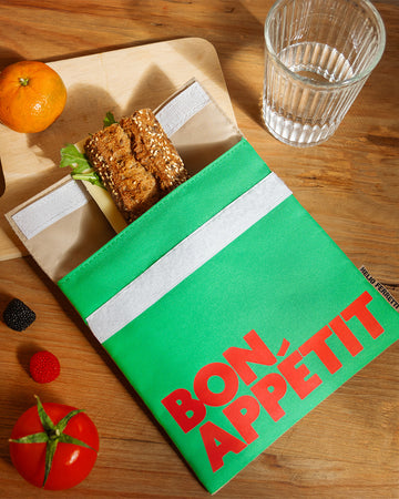 green and cream snack bag with red 'bon appetit' across the front on a table