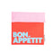 pink and coral snack bag with light blue 'bon appetit' across the front