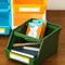 green pile up caddy filled with desk items