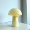 un-lit light yellow mushroom glass table lamp