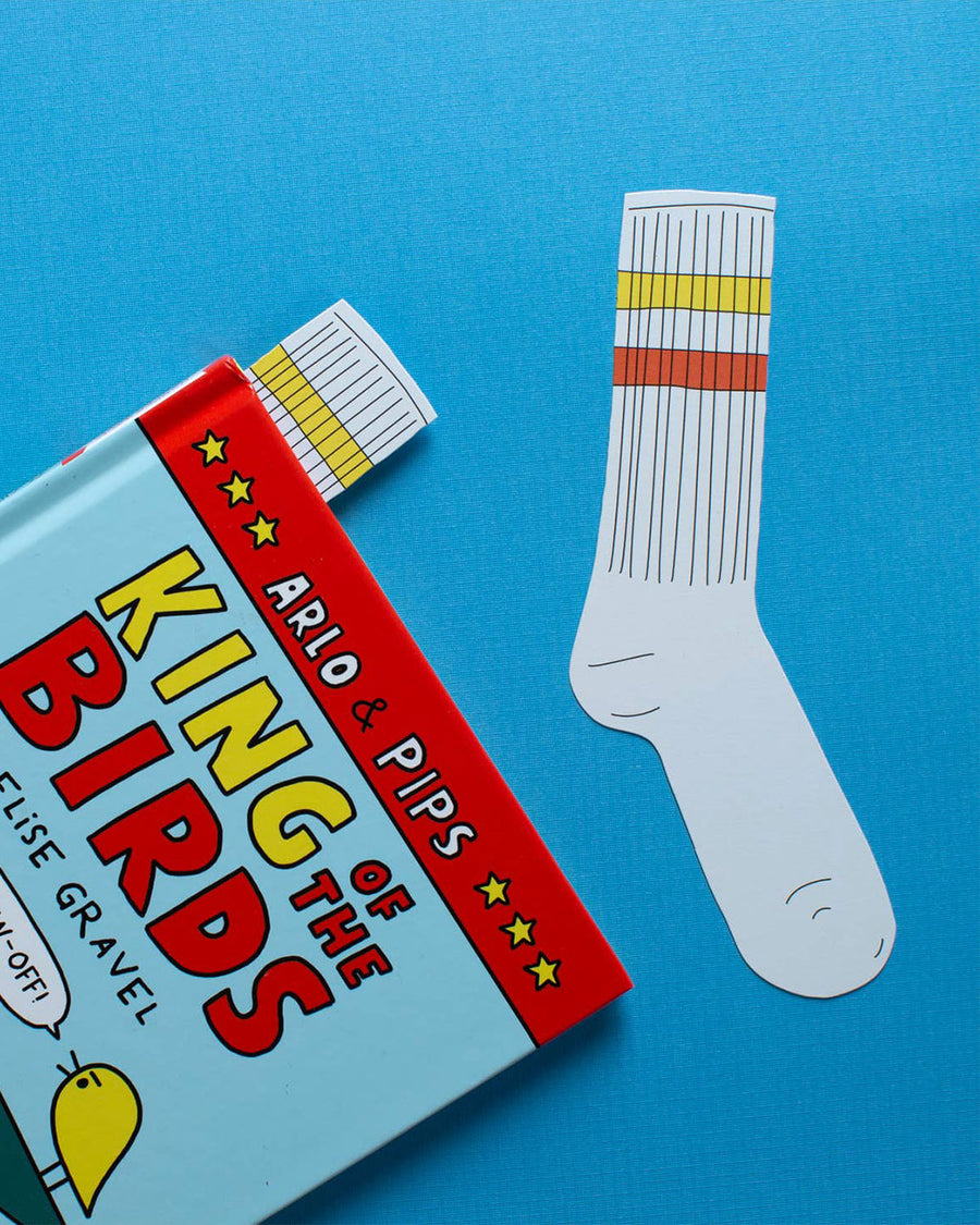 yellow and orange stripe tube sock shaped bookmark  in closed book