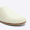 up close of cream leather slip on mules with a natural sole
