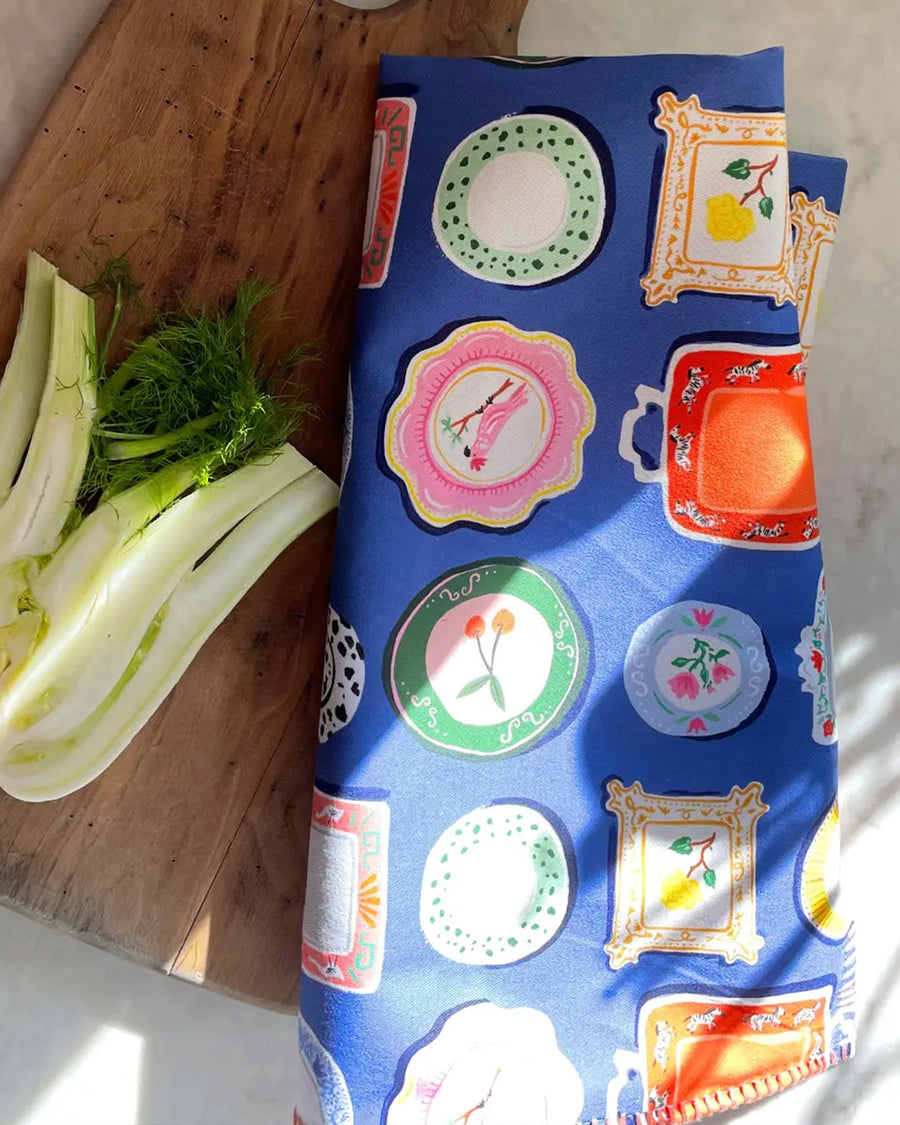 cobalt cotton tea towel with colorful dinner plate print
