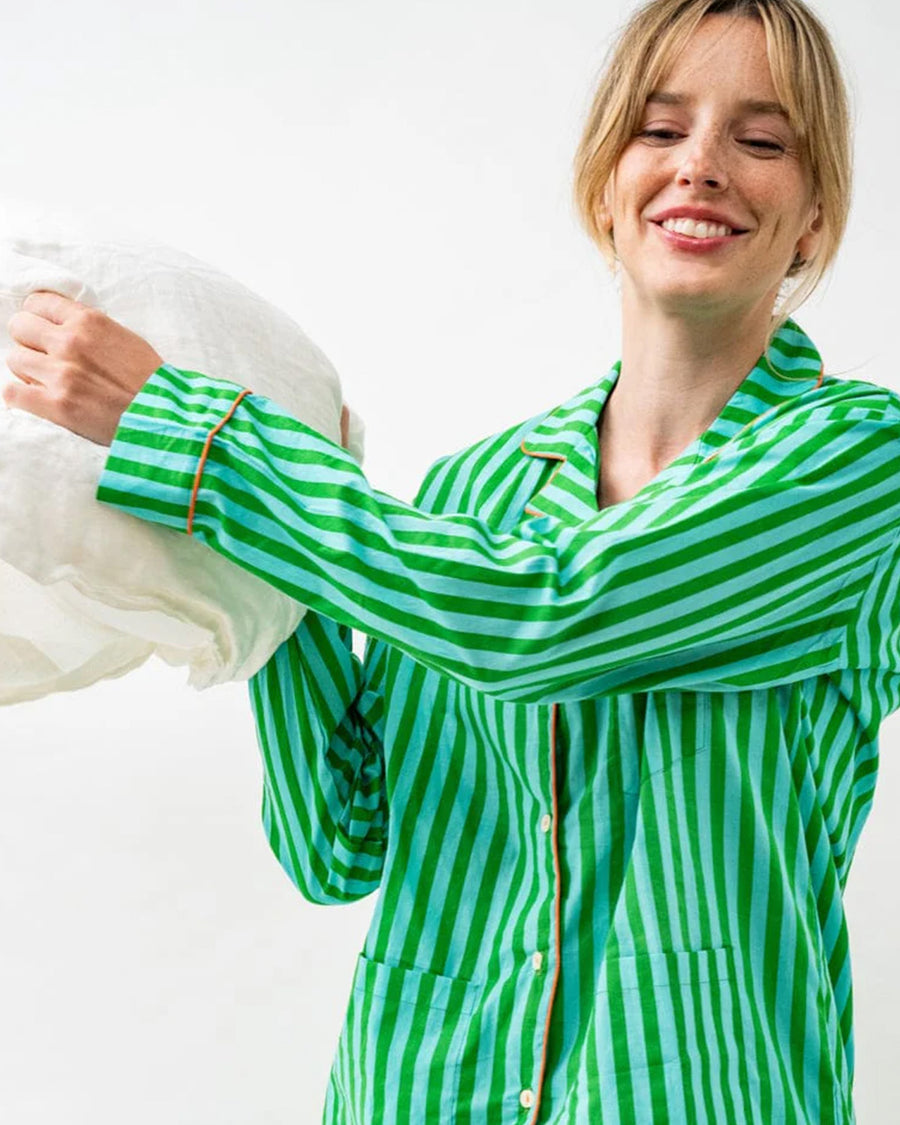 model wearing kelly green and sky blue vertical stripe pj set
