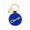 reverse side of yellow and blue beaded caviar bag charm with caviar spoon