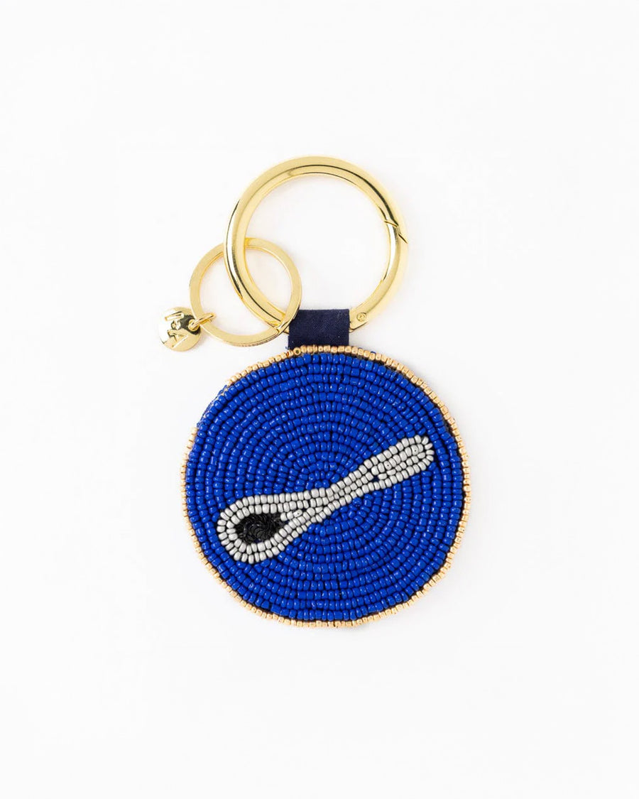 reverse side of yellow and blue beaded caviar bag charm with caviar spoon