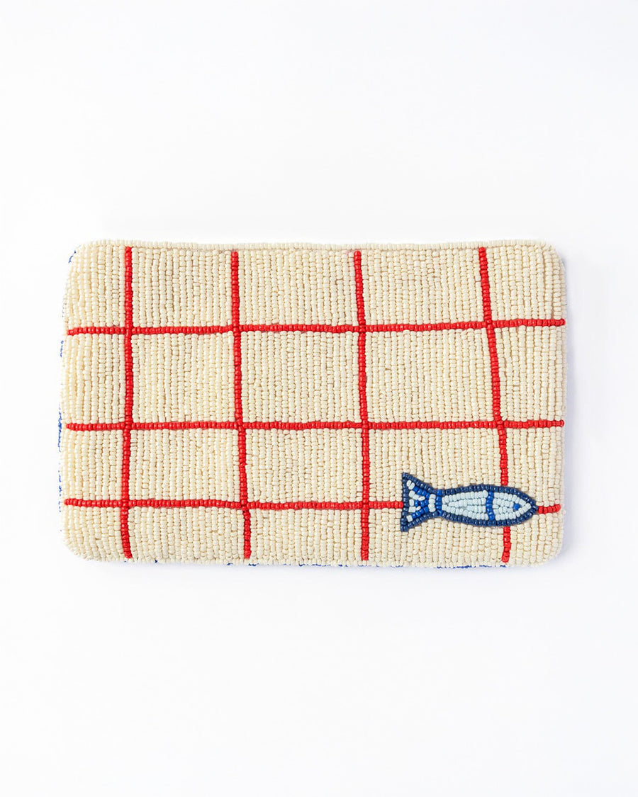reverse cream and red grid beaded clutch with tiny sardine at the bottom