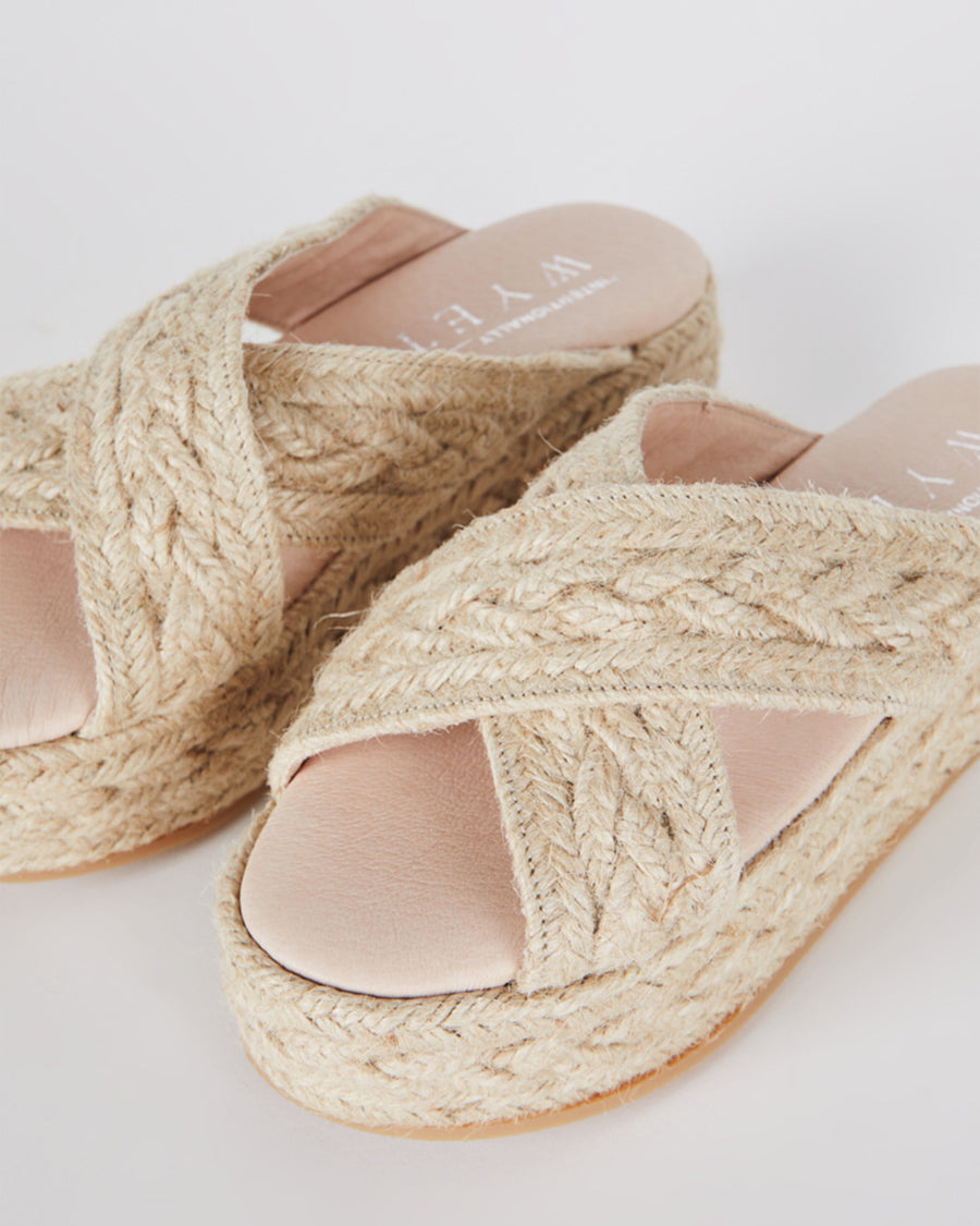 front view of natural suede criss cross straps and jute platform