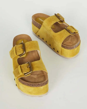 marigold platform shoes with two buckle straps and grommet details on the sides