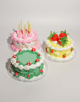 3 fake cake kits: pink sprinkles, yellow strawberries and green mushrooms