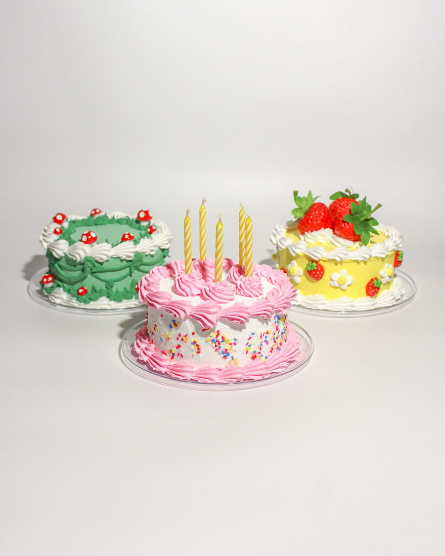 three fake cake kits: mushrooms, strawberries and pink sprinkles