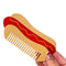 model holding hot dog shaped pocket comb