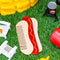hot dog shaped pocket comb surrounded by a bbq background