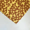 up close of set of two yellow cloth napkins with brown check pattern