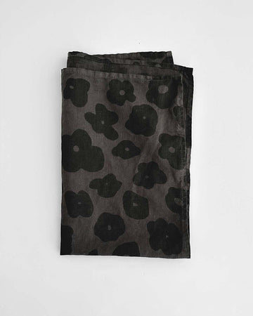 faded black tea towel with black floral print
