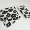 set of 4 cocktail napkins with natural ground and black abstract floral print
