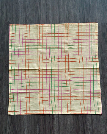 cream tea towel with colorful thin plaid print