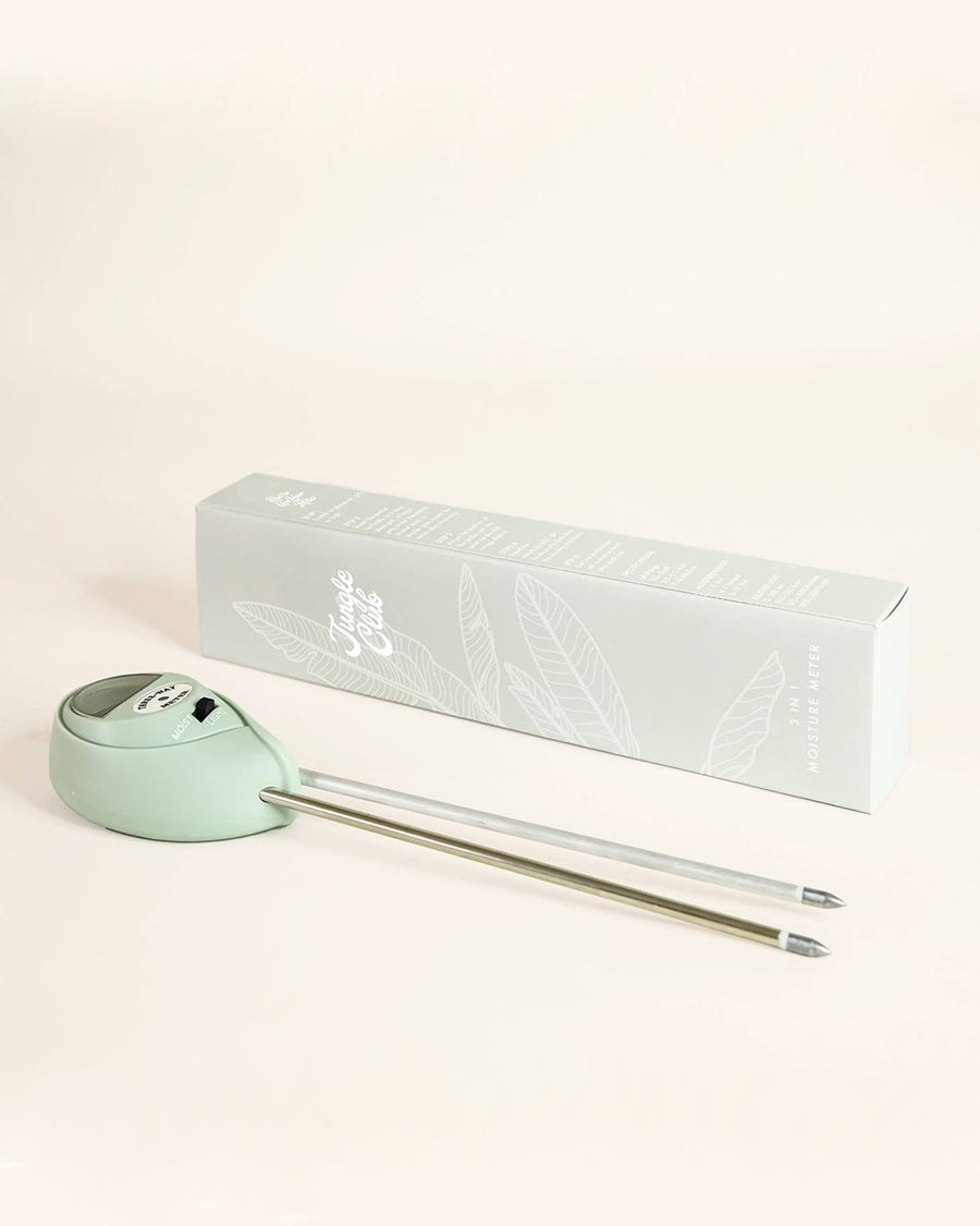 sideview of mint jungle club moisture meter and box
