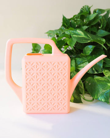 peach watering can with engraved geo design