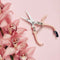light pink pruning shears next to pink flowers