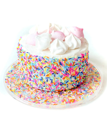 acrylic cake tray filled with colorful sprinkles